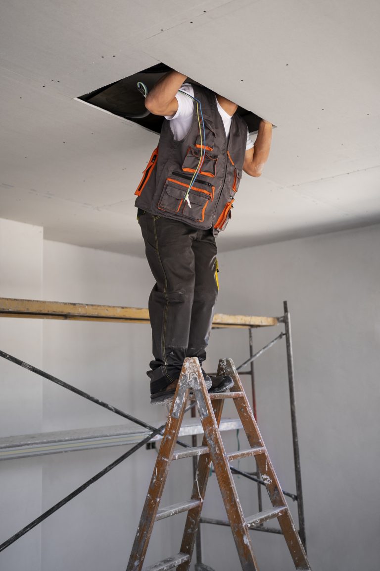 construction-worker-standing-ladder