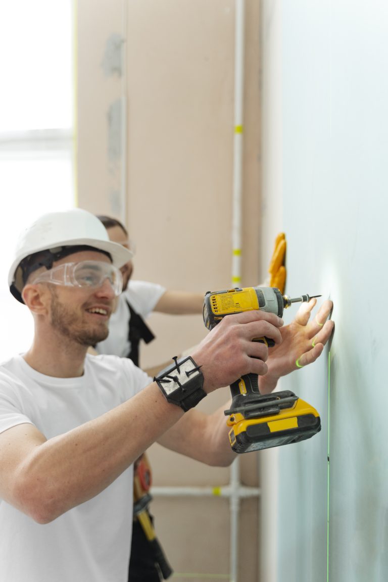 medium-shot-smiley-man-holding-drill